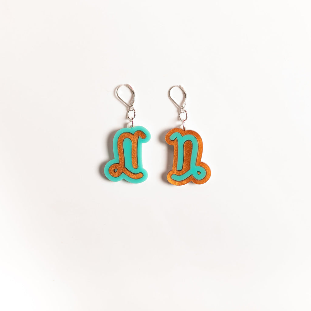 The Capricorn Sign Dangle Earrings